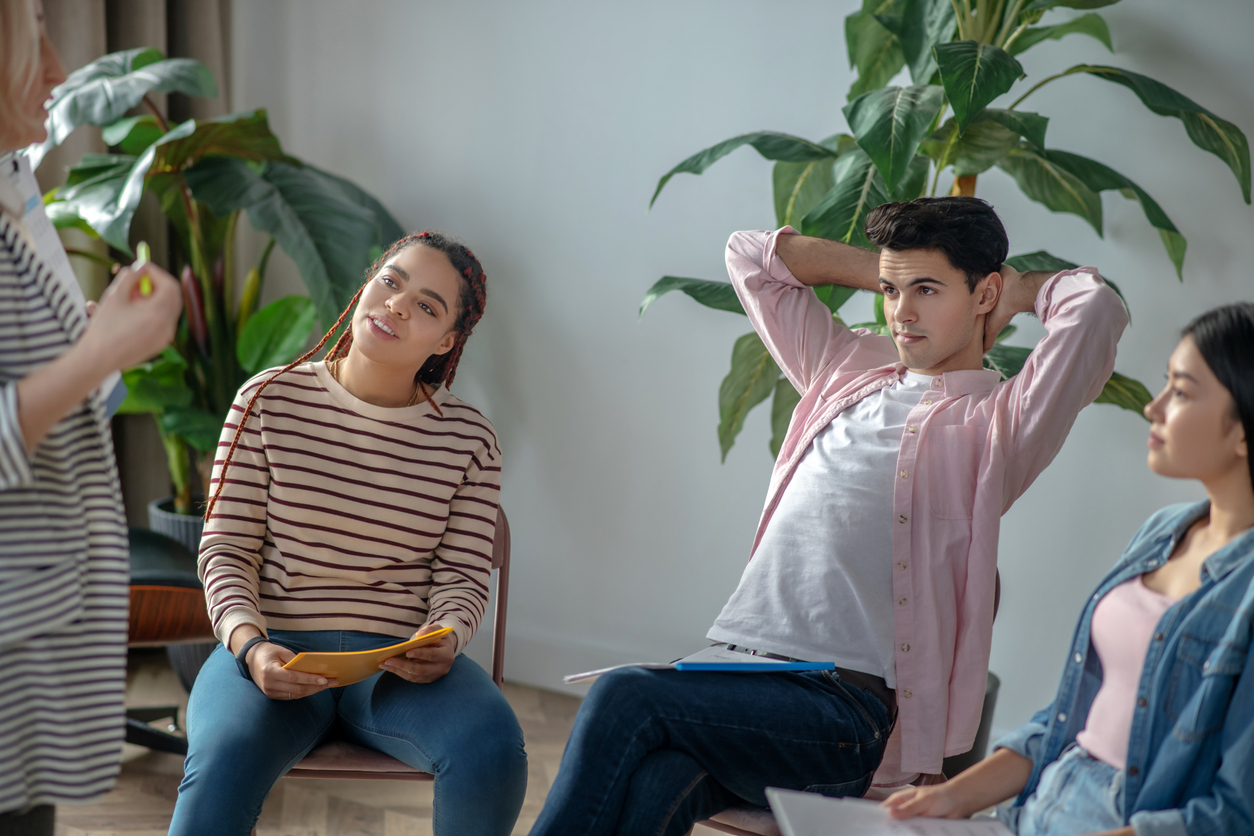 Young dark-haired man putting hands behind his head Unlocking the Door to Recovery and Renewal in Hanover, MA